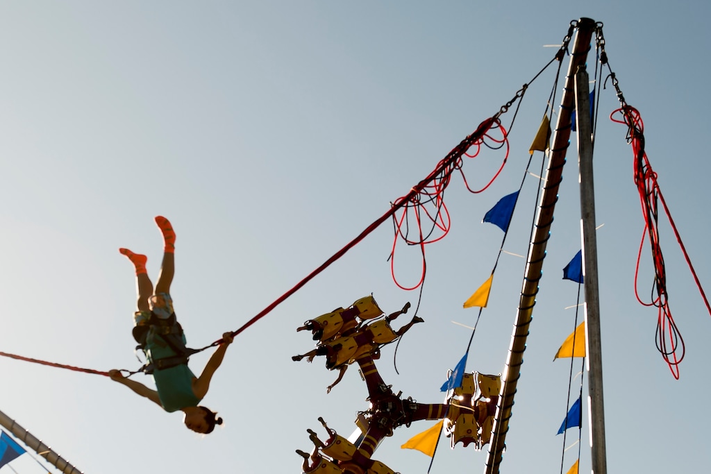 (Jeremy Harmon | The Salt Lake Tribune) People ride the Power Jump and Black Out rides at the Utah State Fair in Salt Lake City on Saturday, September 14, 2019.