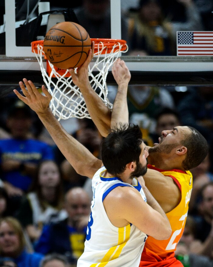 (Steve Griffin  |  The Salt Lake Tribune) Utah Jazz center Rudy Gobert (27) draws contact from Golden State Warriors forward Omri Casspi (18) during the Utah Jazz versus Golden State Warriors at Vivint Smart Home Arena in Salt Lake City Tuesday January 30, 2018.