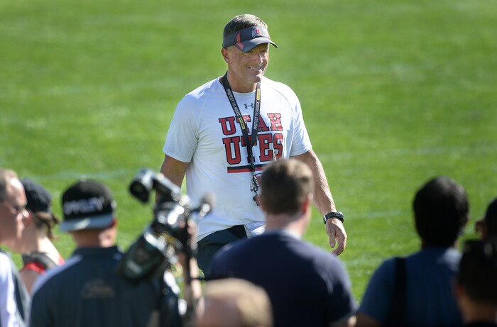 Scott Sommerdorf   |  The Salt Lake Tribune  Utah head coach Kyle Whittingham heads toward a group of reporters after the first day of Utah fall football camp, Friday, July 28, 2017.  