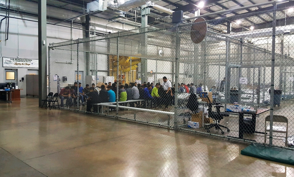 (U.S. Customs and Border Protection's Rio Grande Valley Sector | The Associated Press) In this photo provided by U.S. Customs and Border Protection, people who've been taken into custody related to cases of illegal entry into the United States, sit in one of the cages at a facility in McAllen, Texas, Sunday, June 17, 2018.