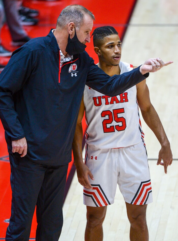 (Leah Hogsten  |  The Salt Lake Tribune) Utah Utes head coach Larry Krystkowiak talks with Utah Utes guard Alfonso Plummer (25) during Tuesday's NCAA basketball matchup with Idaho State, Dec. 8, 2020 at the Jon M. Huntsman Center. Utes defeated Idaho State 75-59.