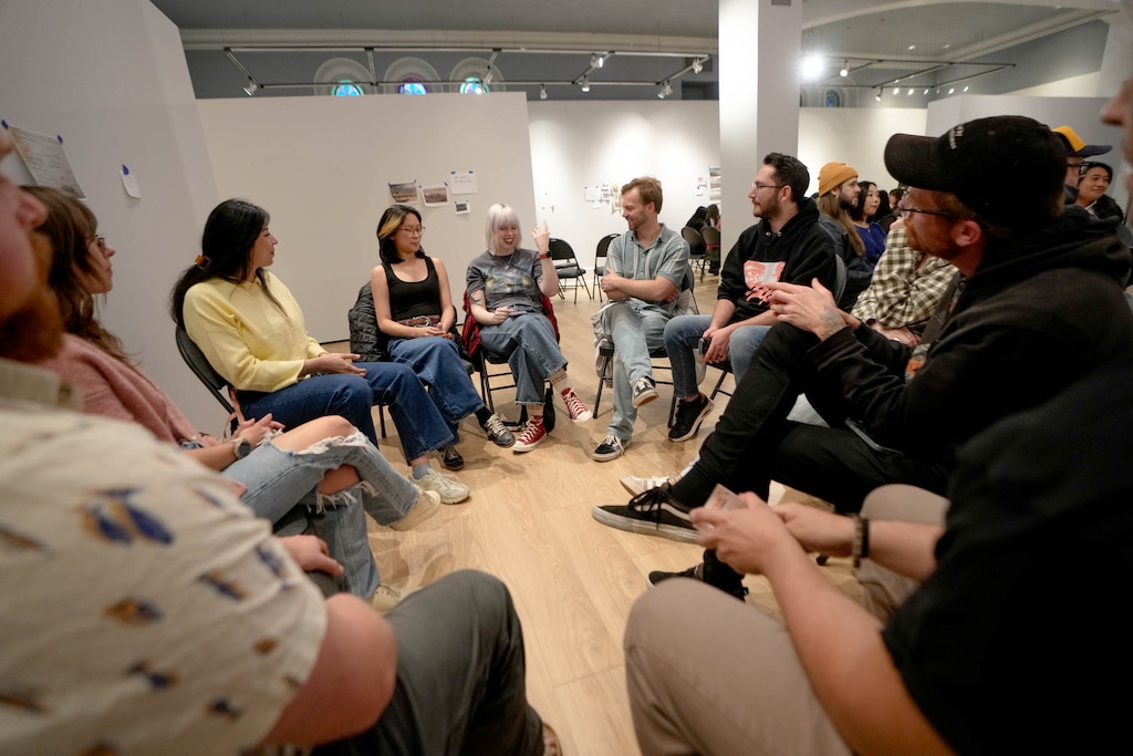 (Francisco Kjolseth | The Salt Lake Tribune) People gather for the monthly album club to discuss Erykah Badu’s ‘Mama’s Gun,’ at the Salt Lake Art Museum on Wednesday, April 15, 2026. The monthly gathering brings a diverse group of people to discuss an album, much like a book club, but for music.