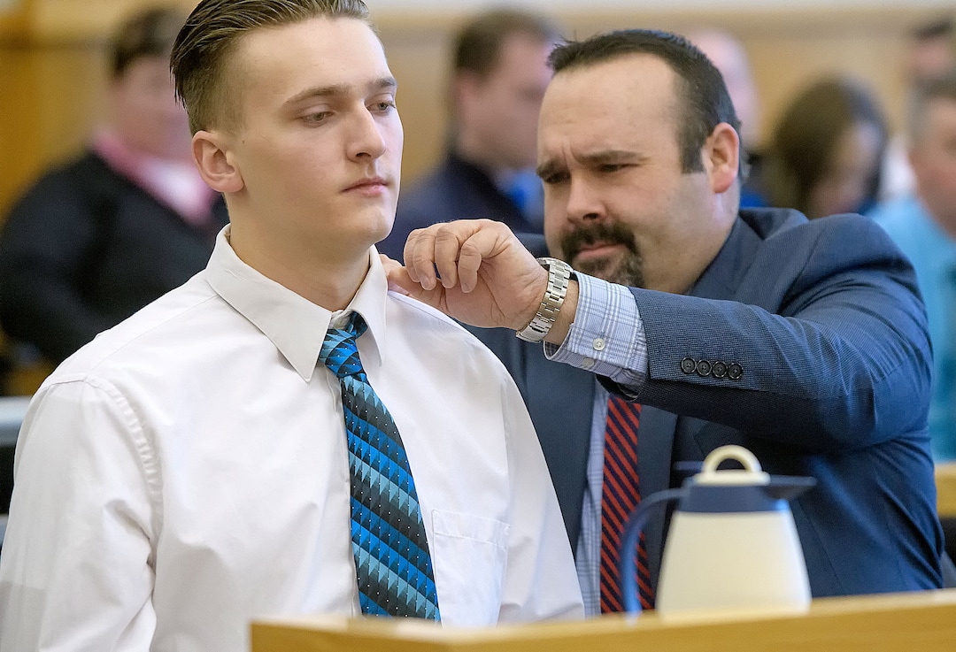 (Eli Lucero  |  Herald Journal, pool) Defense attorney Michael McGinnis, right, fixes the shirt collar of Colter Peterson before his sentencing for attempted aggravated murder and robbery, Thursday, Feb. 1, 2018, in Logan, Utah. Peterson received a sentence of 15 years to life for shooting Deserae Turner in February 2017, and leaving her for dead in a dry irrigation canal in Smithfield, Utah.