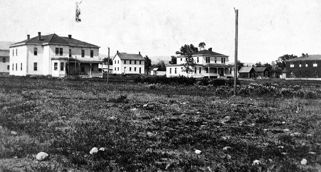 (Uintah County Regional History Center) The Uintah Boarding School in Whiterocks is seen in this photo from about 1912. Laundry and farm outbuildings are visible behind the three main school and dormitory buildings in front.