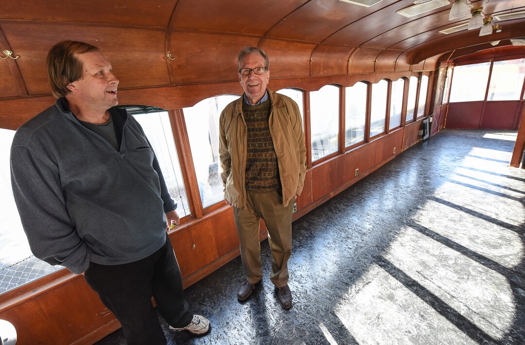 (Francisco Kjolseth  |  The Salt Lake Tribune)  Boris Walther, 78, right, takes a trip down memory lane as he tours the inside of the last Utah trolley car alongside trolley enthusiast Bob Mertens. Walther, the last living wood craftsman that worked on the trolleys back in 1972, recalls the details seen inside following a repositioning of the iconic trolley car on Monday, Oct. 15, 2018, that has been sitting in storage for several years and was placed back into view at Trolley Square.
