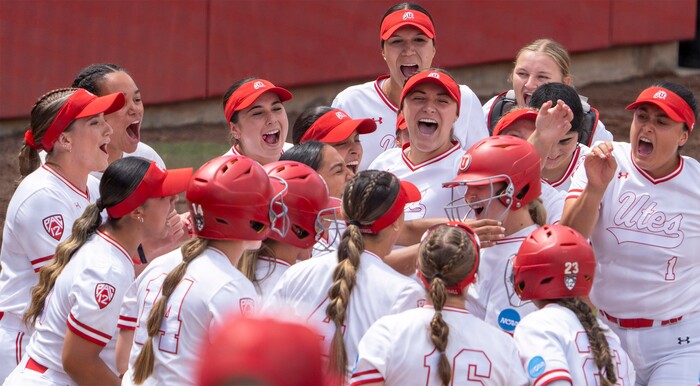 (Rick Egan | The Salt Lake Tribune)  The team gathers at home plate to congratulate Ellessa Bonstrom on her two run homer, in NCAA Softball Super Regionals action between the Utah Utes and the San Diego State Aztecs, on Saturday, May 27, 2023.
