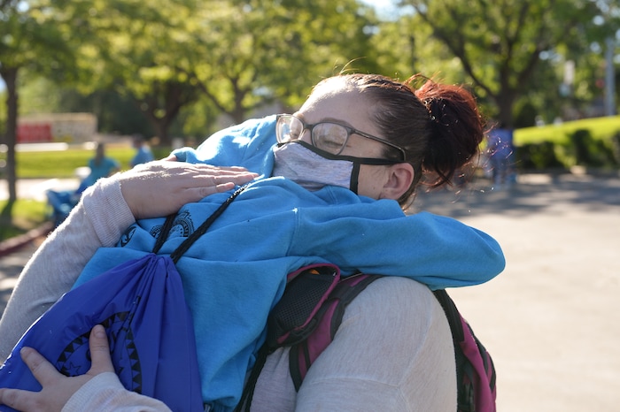 (Chris Samuels | The Salt Lake Tribune) A mom hugs her daughter before leaving for Camp Hope, a camp run by the Salt Lake District Attorney’s office for kids who have been victims of violence, Monday, June 28, 2021.