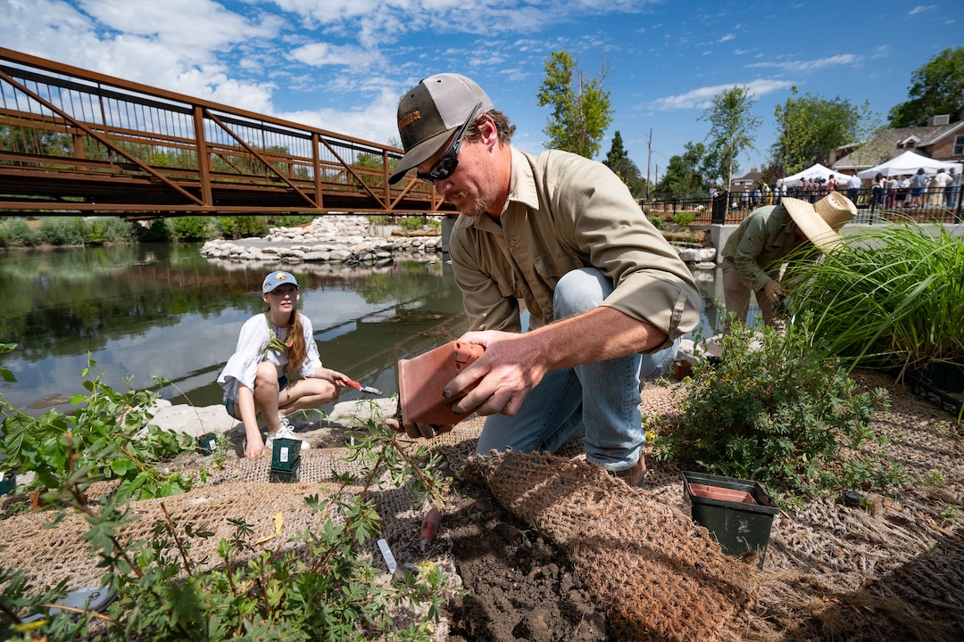(Francisco Kjolseth  |  The Salt Lake Tribune) Aaron Benzon, natural lands supervisor for Salt Lake City trails and natural lands division helps plant shrubs as part of the new Three Creeks Confluence Park on Wednesday, July 7, 2021, in the Glendale neighborhood.