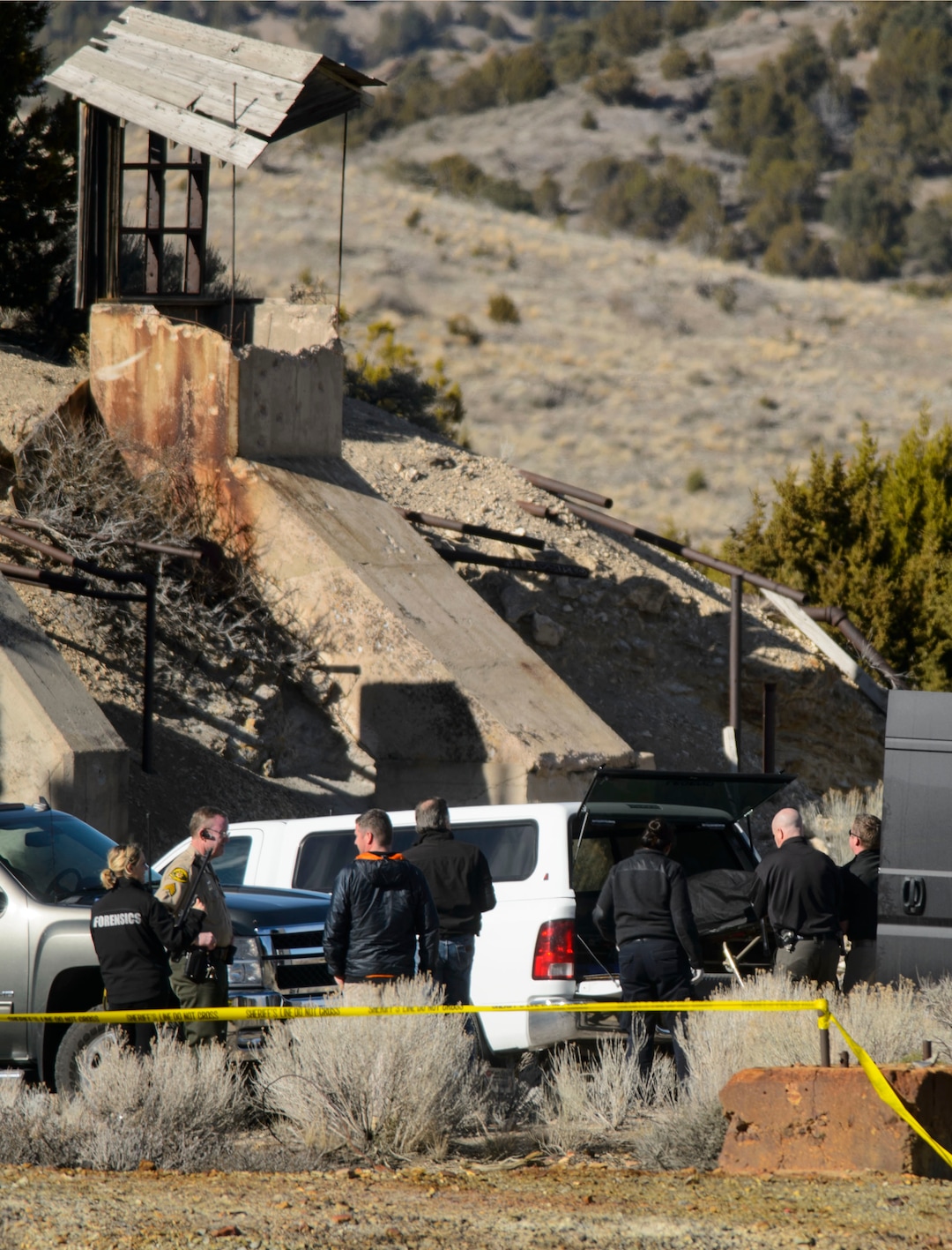 (Steve Griffin  |  The Salt Lake Tribune) Law enforcement officials load one of two bodies into the Medical Examiners truck after they were recovered from an abandoned mine in UtahÕs west desert near Eureka Wednesday March 28, 2018. Police believe the bodies are those of two teenagers who have been missing for nearly three months. in  Wednesday March 28, 2018.