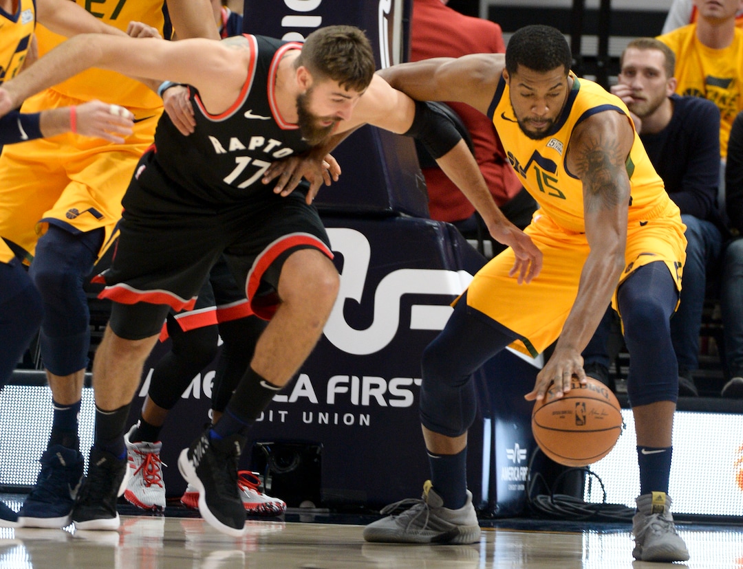 Leah Hogsten  |  The Salt Lake Tribune  Utah Jazz forward Derrick Favors (15) grabs the rebound over Toronto Raptors center Greg Monroe (15) as the Utah Jazz host the Toronto Raptors, Monday, Nov. 5, 2018 at  Vivint Smart Home Arena.
