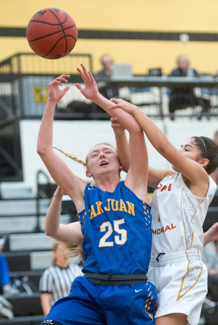 (Rick Egan  |  The Salt Lake Tribune)   Bodell Nielson (25) San Juan, is fouled by  Emily Garcia (1), Judge Memorial, in 3A Women's basketball State playoff action Judge Memorial Vs. San Juan, in Heber City, Friday, Feb. 16, 2018.