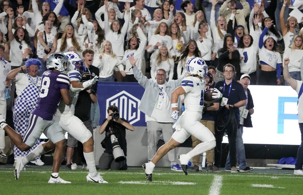 (Bethany Baker | The Salt Lake Tribune) Brigham Young Cougars wide receiver Parker Kingston (11) returns a punt for a touchdown during the game between the Brigham Young Cougars and the Kansas State Wildcats in Provo on Saturday, Sept. 21, 2024.
