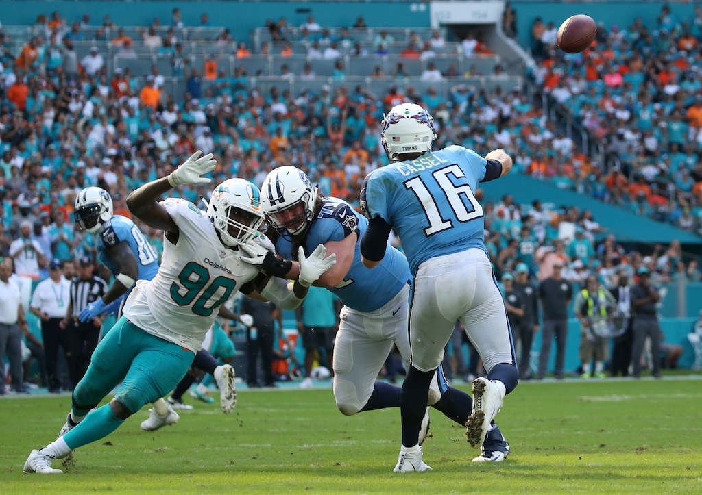 Tennessee Titans quarterback Matt Cassel (16) throws the ball as Miami Dolphins defensive end Charles Harris (90) attempts to get to him, during the second half of an NFL football game, Sunday, Oct. 8, 2017, in Miami Gardens, Fla. (AP Photo/Joel Auerbach)