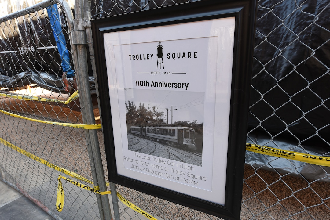 (Francisco Kjolseth  |  The Salt Lake Tribune)  The iconic trolley car, that has been sitting in storage for several years, is moved back into view at Trolley Square on Monday, Oct. 15, 2018. The empty trolley car, last seen housing the Trolley Wing Company was moved into place on the north plaza by Pottery Barn.
