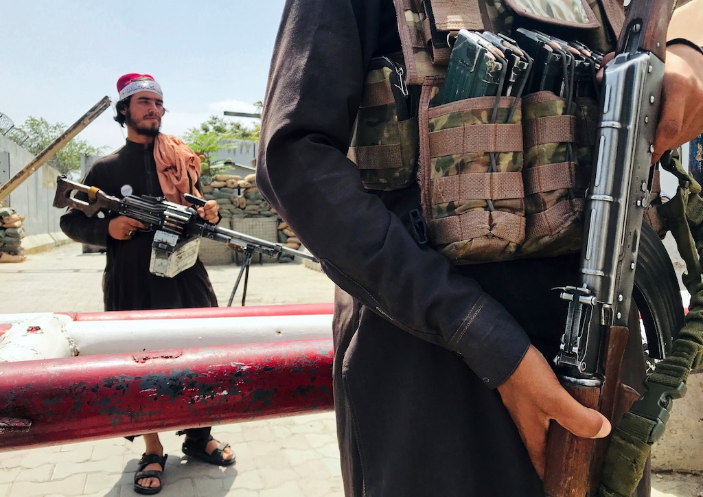 (AP) Taliban fighters stand guard at a checkpoint near the US embassy that was previously manned by American troops, in Kabul, Afghanistan, Tuesday, Aug. 17, 2021. The Taliban declared an "amnesty" across Afghanistan and urged women to join their government Tuesday, seeking to convince a wary population that they have changed a day after deadly chaos gripped the main airport as desperate crowds tried to flee the country.