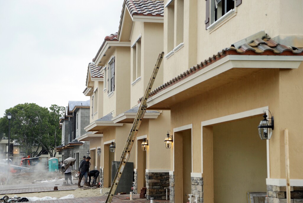 (Lynne Sladky | The Associated Press) In this Thursday, Sept. 22, 2016, file photo, Lennar Corporation town homes are under construction at Chelsea Place in Tamarac, Fla. On Monday, Nov. 27, 2017, the  Commerce Department releases new home sales for October.