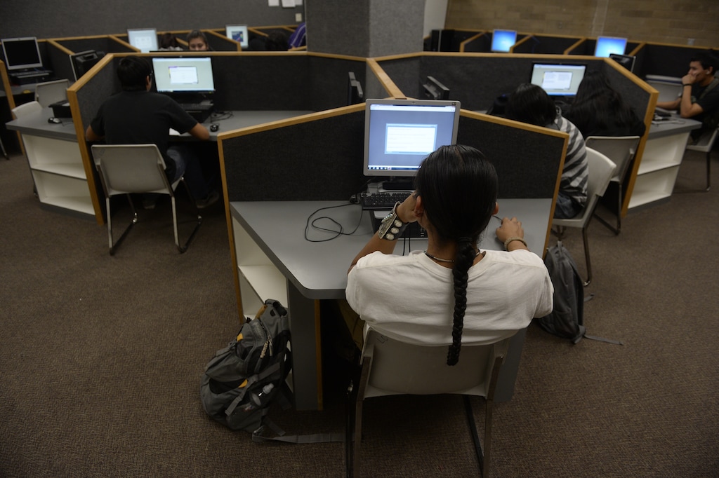 (Rick Egan  | The Salt Lake Tribune) Remington Begay, a senior at Monument Valley High School, works on a computer at the school on Thursday, January 30, 2014.
