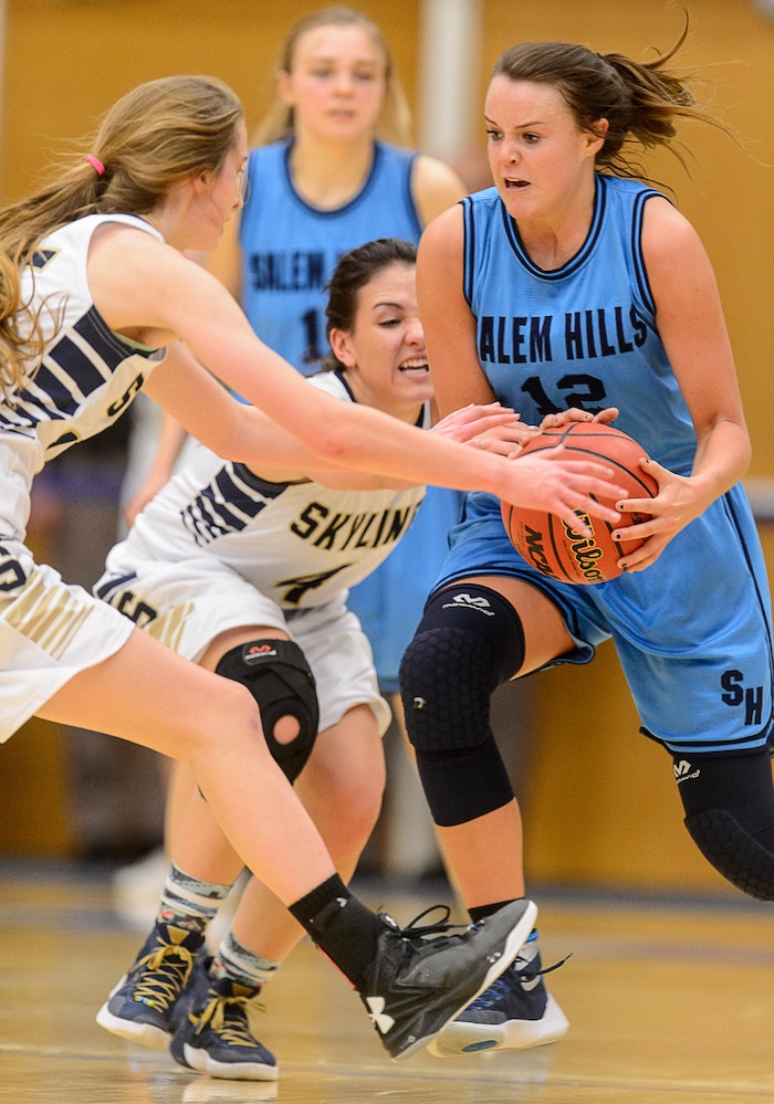 Trent Nelson  |  The Salt Lake TribuneSkyline's Hannah Anderl (15) and Skyline's Lauryn Crofts (4) try to steal the ball from Salem Hills's Lauren Gustin (12)  as Skyline faces Salem Hills in a quarterfinals game at the 4A High School Girls Basketball Tournament at Salt Lake Community College in Taylorsville, Wednesday February 24, 2016.