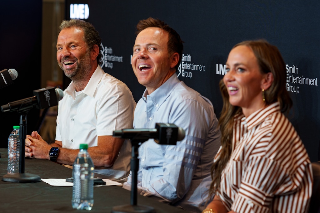 (Trent Nelson  |  The Salt Lake Tribune) Michael Rapino of Live Nation, with Ryan and Ashley Smith of Smith Entertainment Group, at the announcement of a new Salt Lake City music venue on Tuesday, Aug. 19, 2025.