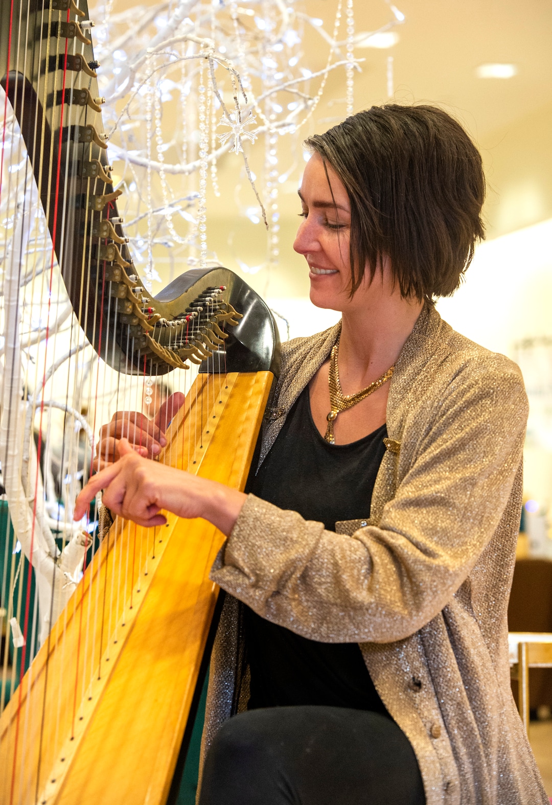 (Rick Egan  |  The Salt Lake Tribune)       Linsey Lesser plays then harp, at the second annual Made in Utah Winter Fest at The Gateway.  The free festival includes local artists, musicians, artisans, breweries, distilleries, food trucks, and other local businesses, to help promote shopping locally for holidays. The Utah Winter Fest continues December 21 & 22. Sunday, Dec. 15, 2019.