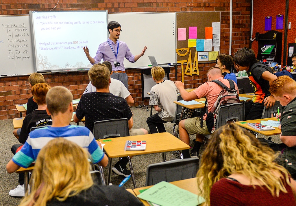 (Leah Hogsten | The Salt Lake Tribune) Teacher Pinyi Yao welcomes his students on their first day of the school year at Oquirrh Hills Middle School on August 20, 2019 in Riverton. The school will move online for two weeks starting Nov. 19, 2020, because of COVID-19.