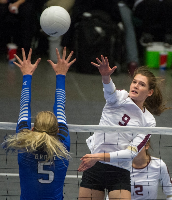 (Rick Egan  |  The Salt Lake Tribune)   Lone Peak Knights  Madelyn Robinson (9)  hits the ball, as Pleasant Grove Vikings Heather Gneiting (5) defends, in the 6A volleyball championship action, Pleasant Grove vs. Lone Peak, at Utah Valley University, Saturday, November 4, 2017.