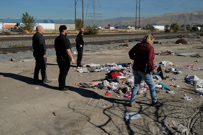 (Francisco Kjolseth  |  The Salt Lake Tribune)  Members of One Voice Recovery and the Volunteers Of America team up as they check on a former homeless camp near the railroad tracks in West Salt Lake. One Voice Recovery provides a needle exchange program for those in need in an ongoing intervention effort to keep the dialogue open and help people seek prevention services.