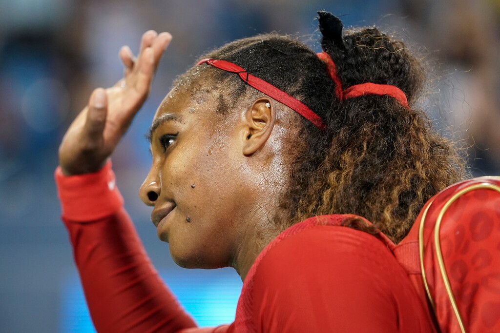 Serena Williams waves to the crowd after losing her match against Petra Kvitova, of the Czech Republic, at the Western & Southern Open tennis tournament, Tuesday, Aug. 14, 2018, in Mason, Ohio. (AP Photo/John Minchillo)