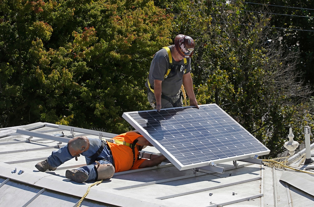 (Rich Pedroncelli | Associated Press file photo) In this Oct. 16, 2015 file photo a solar panel is installed on the roof of the Old Governor's Mansion State Historic Park in Sacramento, Calif. After extensive renovations, Gov. Jerry Brown and his wife, Anne Gust Brown moved into the mansion in late 2015, becoming the first chief executive to live in the home since Ronald Reagan in 1967. The California Energy Commission will take up a proposal, Wednesday, May 9, 2018 , to require solar panels on new residential homes and low-rise apartment buildings up to three starting in 2020.