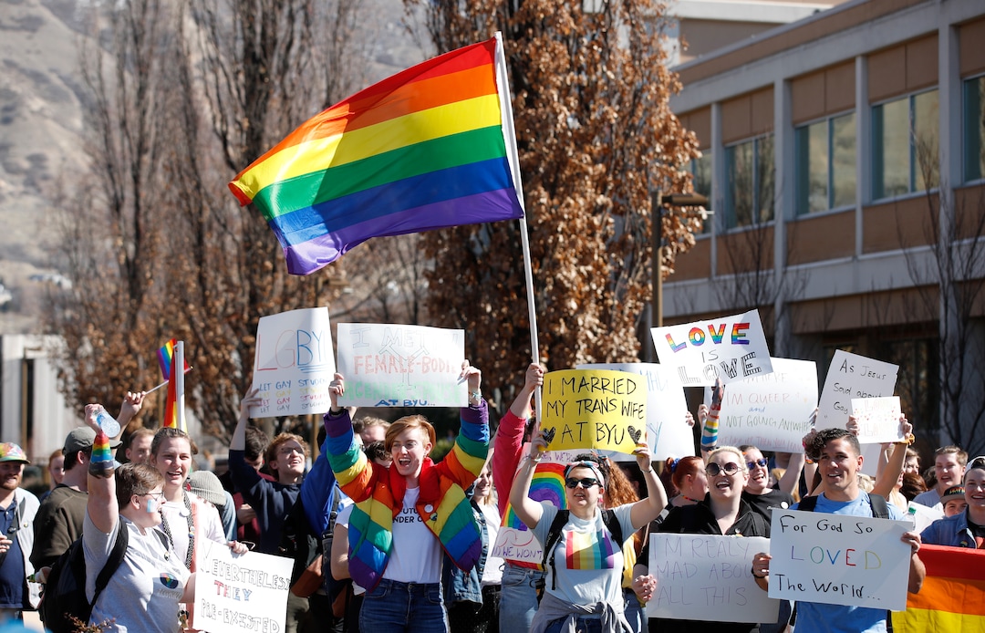 (George Frey  |  special to The Salt Lake Tribune) BYU students and others gather in front of the Ernest L. Wilkinson Student Center on the campus of Brigham Young University to protest BYUÕs rollback of a newly announced policy change on LGBTQ students on March 5, 2020 in Provo, Utah.