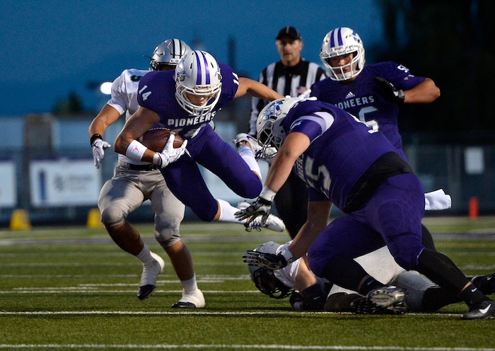(Scott Sommerdorf   |  The Salt Lake Tribune)   Lehi WR Jaxon Moody dives after making a shot catch and run during first half play. Lehi led Olympus 26-0 late in the second half, Friday, September 22, 2017.