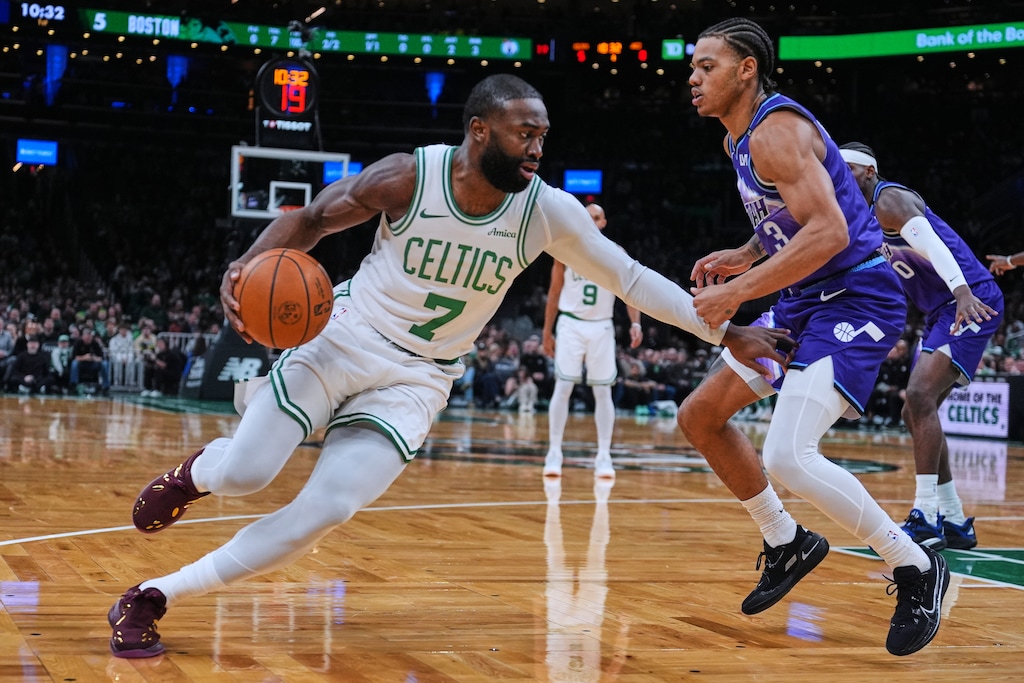 (Charles Krupa | AP) Boston Celtics forward Jaylen Brown (7) drives to the basket against Utah Jazz guard Keyonte George during first half of an NBA basketball game, Monday, Nov. 3, 2025, in Boston.