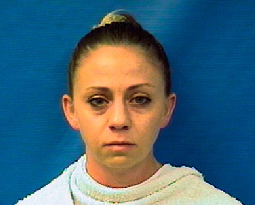 (Kaufman County (Texas) Sheriff's Office via AP) This file photo provided by the Kaufman County Sheriff's Office shows Amber Guyger. A grand jury began hearing evidence Monday, Nov. 26, 2018, in the case of Guyger, a former Dallas police officer who fatally shot her unarmed black neighbor in his own apartment after she said she mistook it for hers on Sept. 6, 2018.