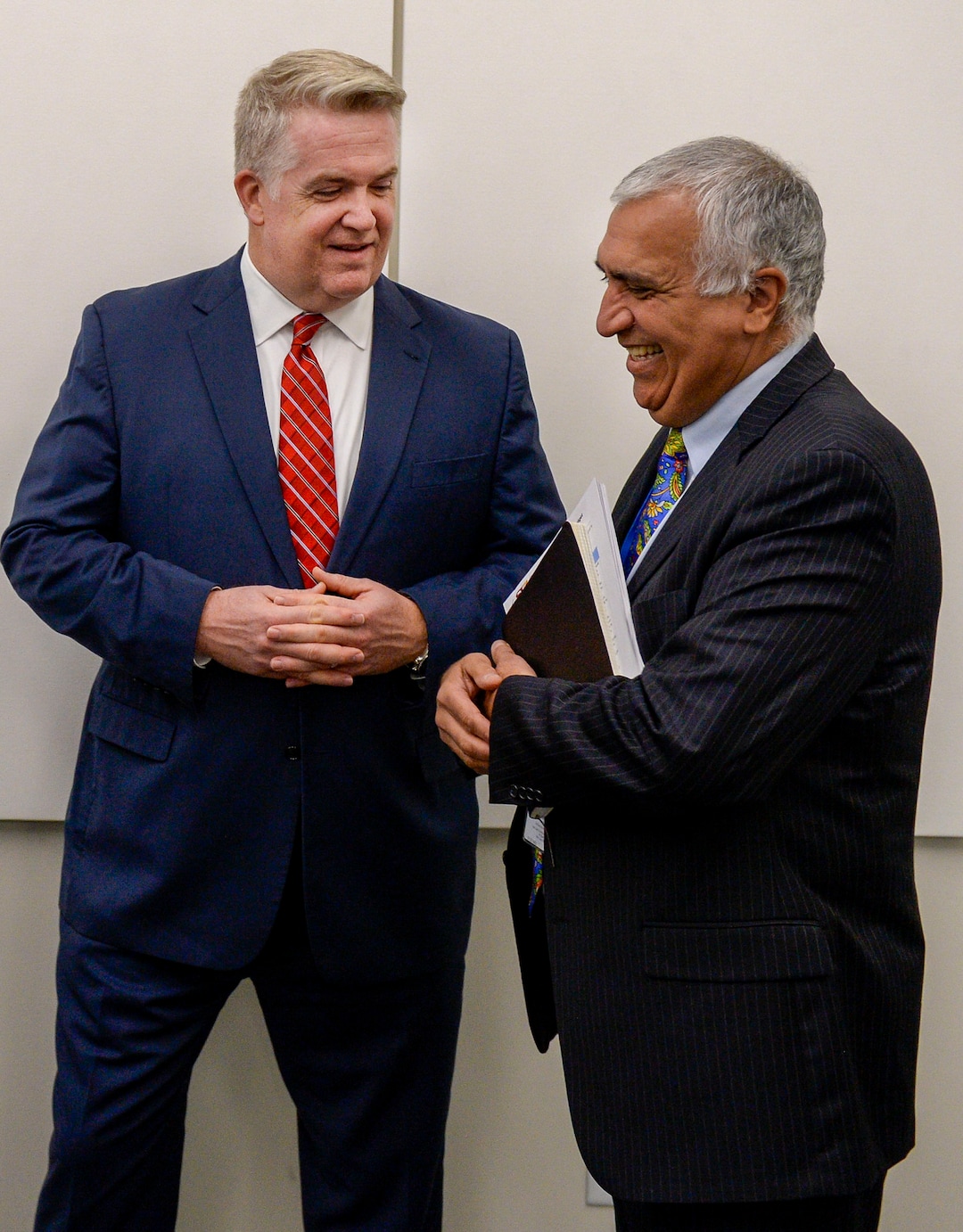 (Leah Hogsten  |  The Salt Lake Tribune) U.S. Attorney John Huber and Salt Lake County District Attorney Sim Gill chat briefly prior to their joint FBI Child Exploitation Task Force press conference to warn Utahns of the "hypersexualized virtual world" and to report the task force findings in the fight to prevent children from being lured by internet predators and raped, kidnapped or murdered, Nov. 19, 2019. The multi-agency representatives reported that the task force netted 30 perpetrators in just four days in one month and called attention to the need for parents to police their children's online presence. "We expect you to step up and protect your children," said Gill.