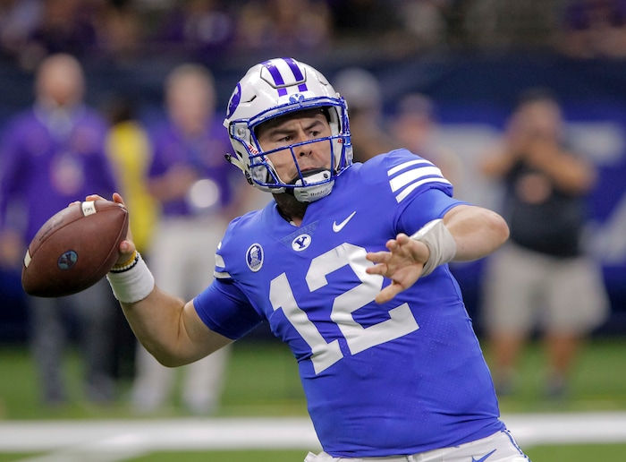 BYU quarterback Tanner Mangum (12) passes against LSU in the first half of an NCAA college football game in New Orleans, Saturday, Sept. 2, 2017. (AP Photo/Scott Threlkeld)