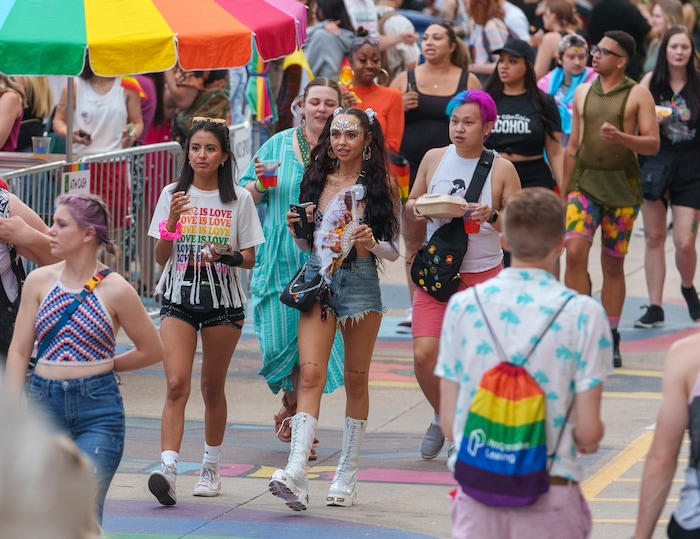 (Leah Hogsten | The Salt Lake Tribune)  Pride festival revelers enjoy the Utah Pride Festival at Washington Square, Saturday, June 4, 2022. 