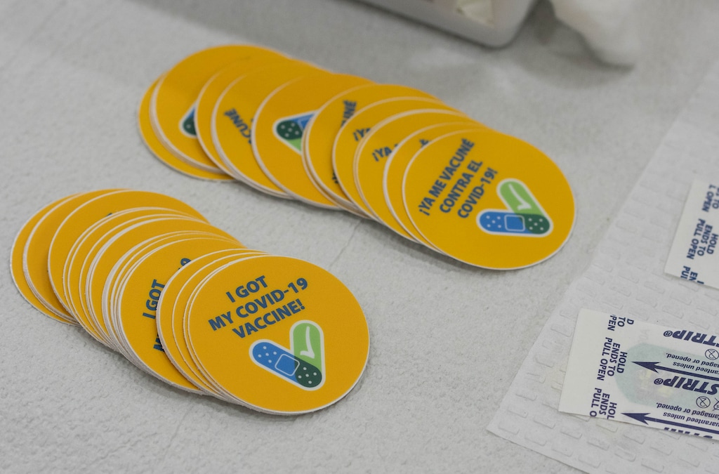 (Francisco Kjolseth | The Salt Lake Tribune) Stickers in English and Spanish are available for people getting vaccinated against COVID-19 at the former Provo High School at 1125 N. University Ave. on Wednesday, July 28, 2021.