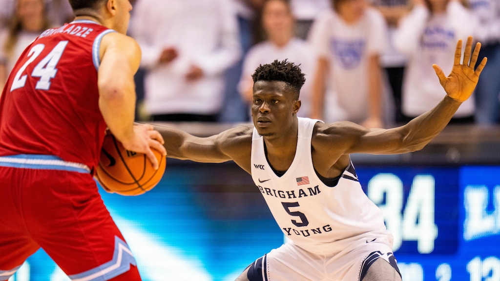 (Rick Egan | The Salt Lake Tribune) Brigham Young Cougars forward Gideon George (5) guards Loyola Marymount Lions forward Alex Merkviladze (24), in WCC basketball action at the Marriott Center in Provo, on Thursday, Feb. 24, 2022.