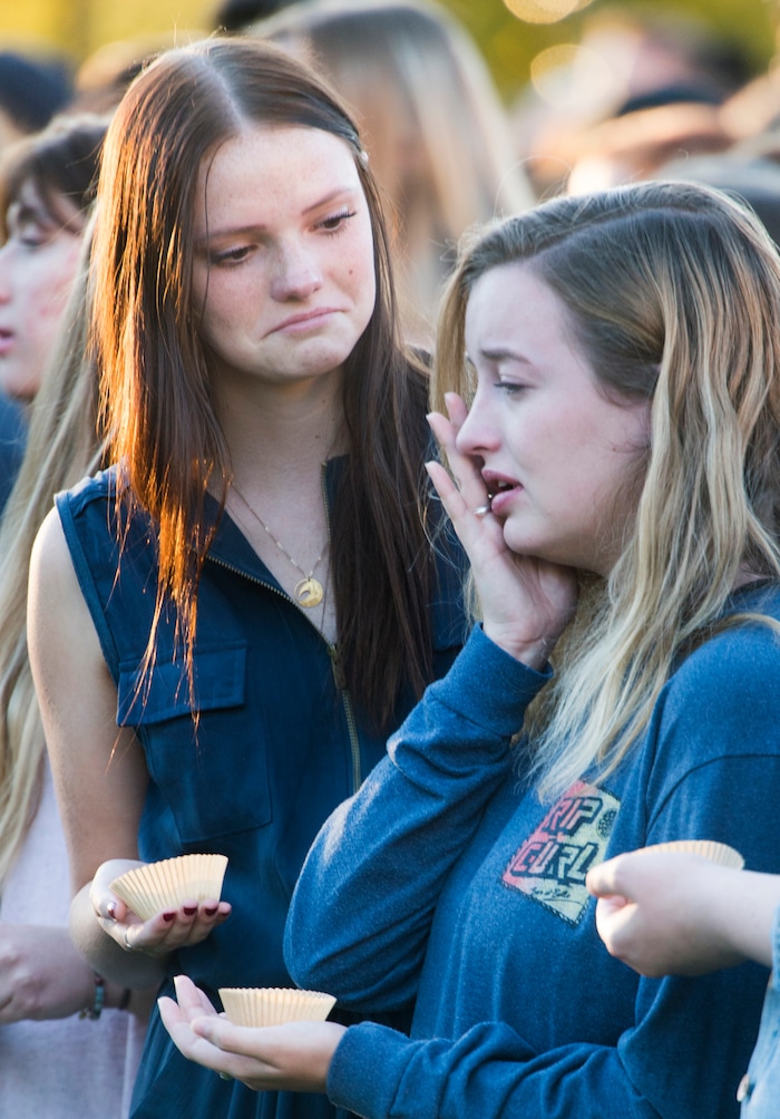 (Rick Egan  |  The Salt Lake Tribune)  Southern Utah University student Taylor Heath (left) comforts Hayley Goen (right) during a candle light vigil for the victims of the Las Vegas shooting, on the SUU campus in Cedar City, Wednesday, October 4, 2017.