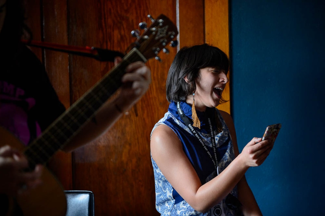 (Trent Nelson | The Salt Lake Tribune)  Olivia Juarez rehearses a song at Rock Camp for Womyn. Those attending the camp learned how to play instruments, form bands, write songs, and perform live in concert — all in three days.