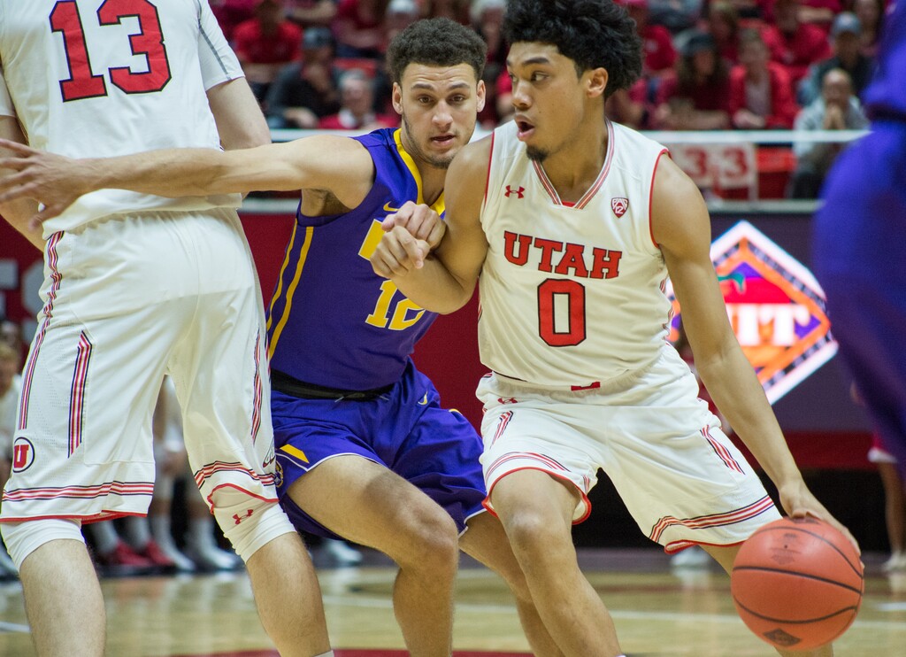 (Rick Egan  |  The Salt Lake Tribune)   Utah Utes guard Sedrick Barefield (0) takes the ball inside, as LSU Tigers guard Marshall Graves (12) defends, in NIT playoff action between Utah Utes and LSU Tigers at the Jon M. Huntsman Center, Monday, March 19, 2018.