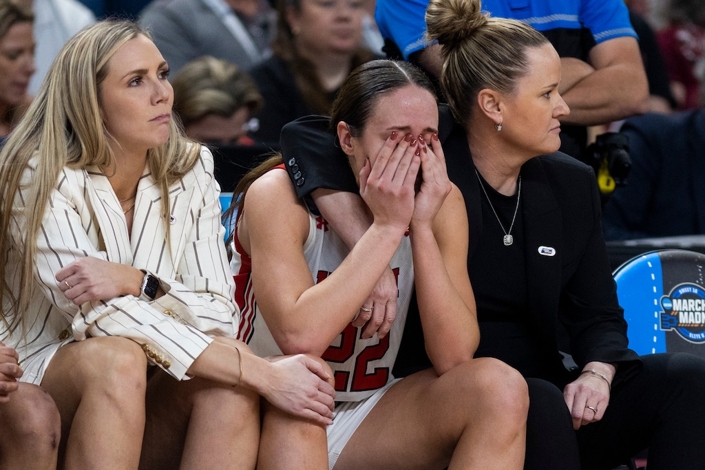 (Mic Smith | AP) Utah's Jenna Johnson (22) is comforted by head coach Lynne Roberts, right, after missing two free throws that could have tied or put the team in the lead late in the second half against LSU during a Sweet 16 college basketball game of the NCAA Tournament in Greenville, S.C., Friday, March 24, 2023.