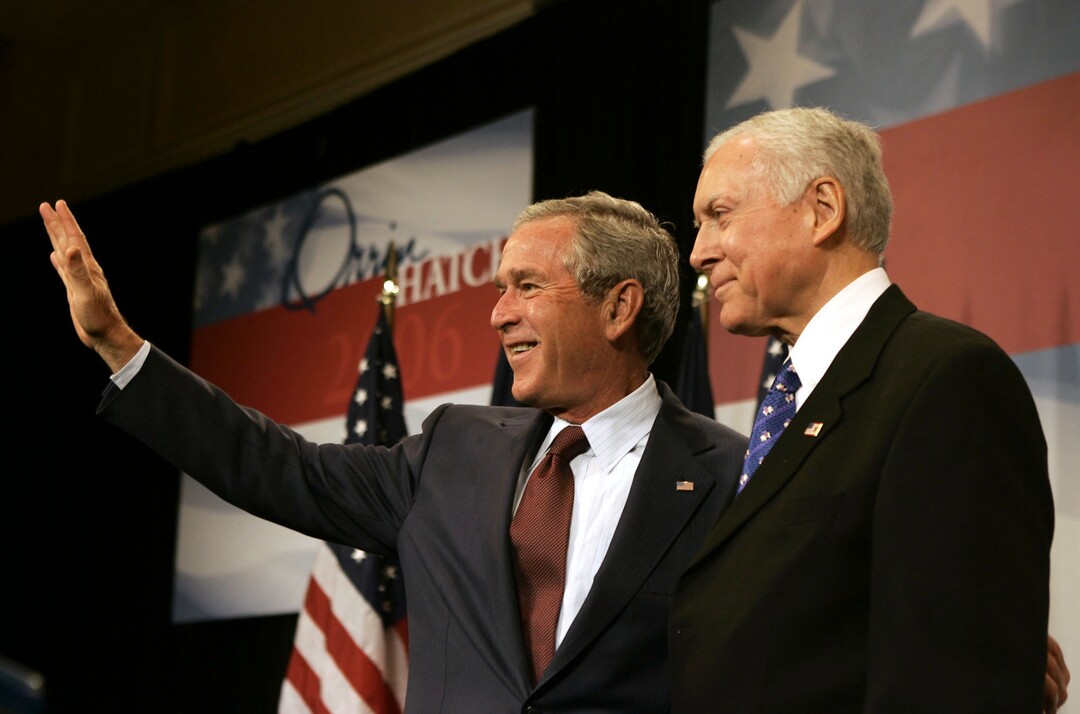 (Evan Vucci | AP) President George Bush waves to the crowd during a fundraiser for the reelection campaign of Sen Orrin Hatch, right, on Thursday, Aug. 31, 2006 in Salt Lake City.