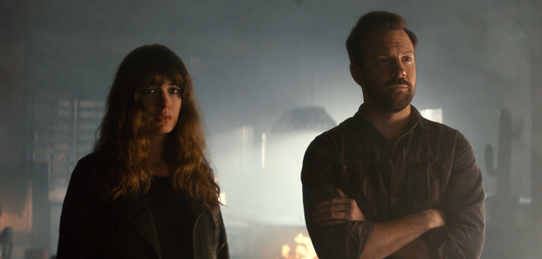 In this image released by Neon, Jason Sudeikis, right, and Anne Hathaway appear in a scene from, "Colossal." (Neon via AP)