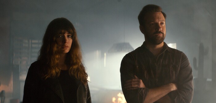 In this image released by Neon, Jason Sudeikis, right, and Anne Hathaway appear in a scene from, "Colossal." (Neon via AP)
