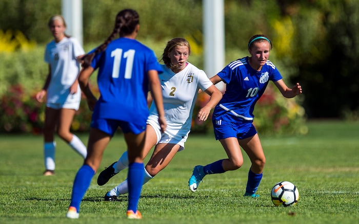 (Chris Detrick | The Salt Lake Tribune) Davis' Tabitha Howard (2) and Fremont's Abbie Deaton (10) go for the ball during the game at Angel Street Soccer Complex in Kaysville Thursday, August 24, 2017. Fremont defeated Davis 5-4 in double overtime.