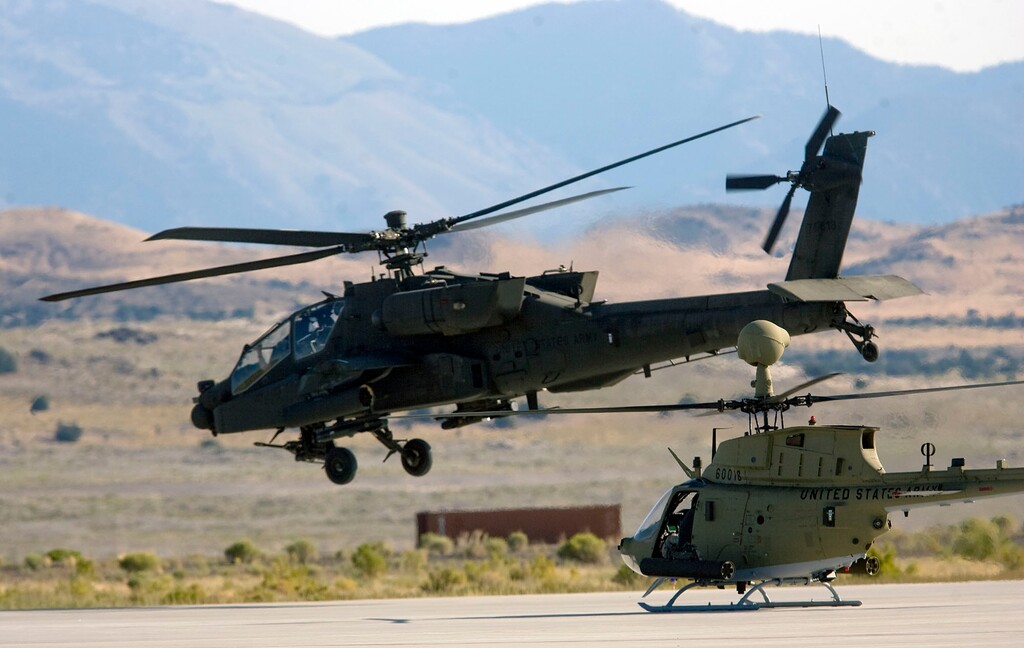 Al Hartmann | The Salt Lake Tribune
Aircraft of the Unmanned System Integration Capability (MUSIC) was demonstrated at Dugway Proving Grounds Thursday Sepetmeber 15. An Apache helicopter, left, takes off followed by a Kiowa during demonstration excercise.