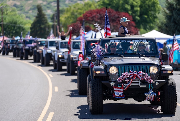 (Rick Egan | The Salt Lake Tribune)  Jeeps seem to stretch for miles in the Cherry Days Fourth of July celebration, in North Ogden, on Monday, July 4, 2022.