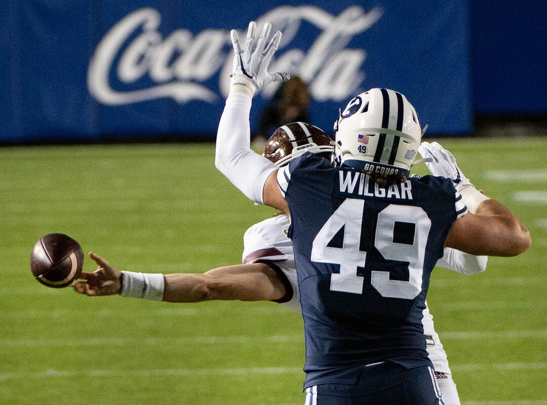 (Francisco Kjolseth  |  The Salt Lake Tribune) Texas State Bobcats quarterback Brady McBride (2) is shut down by Brigham Young Cougars linebacker Payton Wilgar (49) BYU takes on Texas State during an NCAA college football game at LavVell Edwards Stadium, Saturday, oct. 24, as 2020, in Provo, Utah.