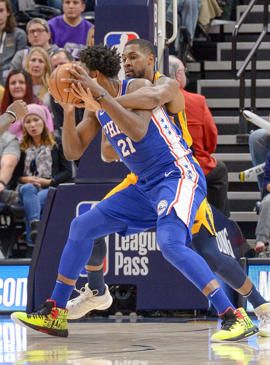 Leah Hogsten  |  The Salt Lake Tribune  Utah Jazz forward Derrick Favors (15) fouls Philadelphia 76ers center Joel Embiid (21) as the Utah Jazz host the Philadelphia 76ers at Vivint Smart Home Arena, Thursday, December 27, 2018. 